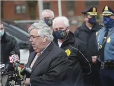  ?? NICOLAUS CZARNECKI / HERALD STAFF ?? ‘DECISIONS TO MAKE’: Norfolk District Attorney Michael Morrissey and, top right, State Police Lt. Col. Scott Warmington speak to the media after the shooting of Eric Leach in Quincy.