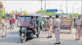  ?? PTI ?? Police personnel screen vehicles at a checkpoint on the first day of the weeklong lockdown in Gurugram, on Monday.
