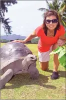  ?? STEVE MacNAULL/The Okanagan Weekend ?? Tyson the 120-year-old tortoise hangs out with Kerry MacNaull on Curieuse island in the Seychelles.