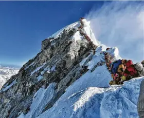  ?? Handout / AFP/Getty Images ?? Crowds of hundreds of climbers congested the 29,035-foot peak last week. About half a dozen climbers died on Mount Everest last week, including a Utah man.