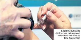  ??  ?? Eligible adults and children are being urged to take up the offer of free flu vaccine