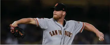  ??  ?? San Francisco Giants relief pitcher Will Smith pitches during the ninth inning of a baseball game against the Los Angeles Dodgers in Los Angeles on Sept. 6. The Atlanta Braves have bolstered their shaky bullpen by signing left-hander reliever Smith to a three-year, $40 million contract. The free agent deal announced Thursday, Nov. 14, 2019, includes a $13 million option for the 2023 season, with a $1 million buyout.