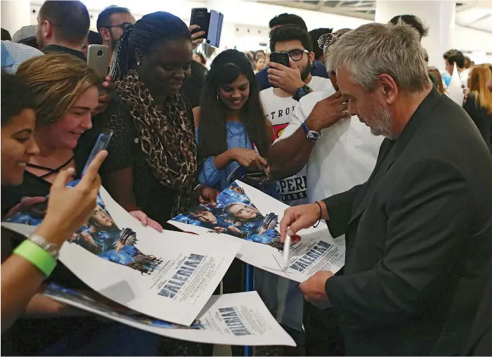  ?? Satish Kumar for The National ?? Luc Besson meets fans at the Valerian premiere in Dubai on Thursday night – the filmmaker has his eye on a sequel