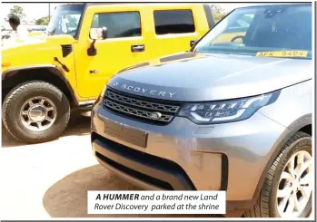  ?? ?? A HUMMER and a brand new Land Rover Discovery parked at the shrine