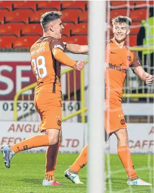  ?? Picture: SNS. ?? Logan Chalmers celebrates his winner with Matty Smith.