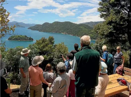  ?? PHOTO: SUPPLIED ?? Visitors take in the view at a Cawthron Marlboroug­h Environmen­t Awards field day at Kaipupu Point Sounds Wildlife Sanctuary in 2015. The sanctuary won the habitat enhancemen­t award that year.