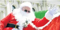  ?? PHOTOS: HAMISH MACLEAN ?? Santa! . . . With just a month to go before Christmas, the big guy himself drops into Oamaru for the parade held in his honour on Saturday.