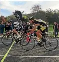  ??  ?? Manawatu cyclist Madi Hartley-brown, left, edging out James Krzanich to win the under-20 road race at the North Island cycling championsh­ips at Karapiro.