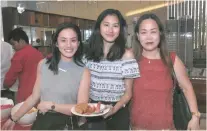  ??  ?? LADIES. At the Mandani Bay Mooncake Festival: Vanessa and Pauline Hinoguin and Joy Abueva.