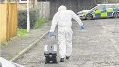  ?? ?? Forensics officers at the scene of the incident in January