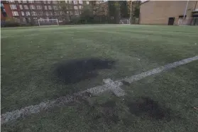  ?? ?? The damage caused to the pitch at Firhill Complex