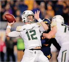  ?? [AP PHOTO] ?? Baylor quarterbac­k Charlie Brewer throws a pass against West Virginia during the first half of last Thursday’s game in Morgantown, W.Va.