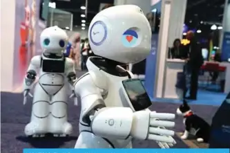  ??  ?? LAS VEGAS: The U-Partner U05 humanoid service robots by Canbot, featured with free speech interactio­n, microsecon­d-level face recognitio­n, autonomous obstacle avoidance walking, bionic action control and smart home hub, are on display during CES 2018....