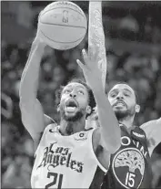  ?? Ben Margot Associated Press ?? CLIPPERS’ Patrick Beverley shoots in front of Golden State Warriors’ Mychal Mulder during rout.