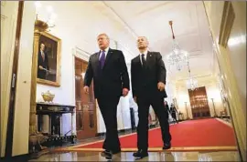  ?? Yuri Gripas Abaca Press ?? PRESIDENT TRUMP and Chinese Vice Premier Liu He, Beijing’s chief negotiator, arrive to sign a long-sought initial trade agreement at the White House.