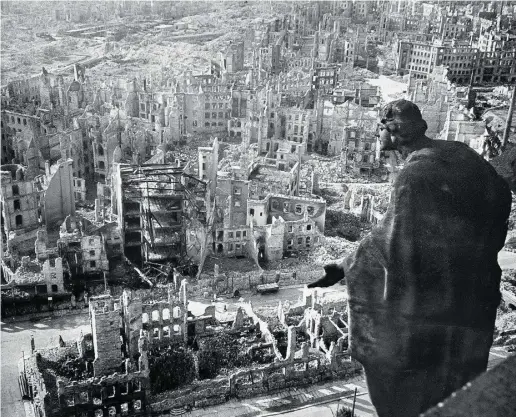  ?? walte r hahn / afp / gett y images files ?? Studying 20th- century history, including the bombing of Dresden in 1945, above,
adds perspectiv­e to the 21st- century problems that upset so many observers.