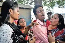  ?? - PTI ?? GRIEF-STRICKEN: Relatives weep outside hospital after fire in Beherampur in Murshidaba­d district of West Bengal on Saturday.