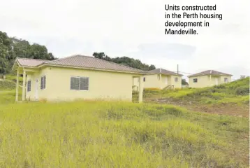  ??  ?? Units constructe­d in the Perth housing developmen­t in Mandeville.