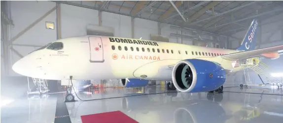  ??  ?? > A Bombardier C-Series jet sits in a Montreal hanger. The US Commerce Department has slapped duties of nearly 220% on Canada’s Bombardier C-Series