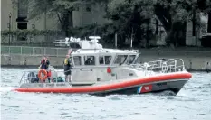  ?? BLAKE FARNAN/SPECIAL TO POSTMEDIA NEWS ?? Emergency personnel from both the United States and Canada are working together during a search operation for a diver from the Buffalo Police Department who went missing in the Niagara River on Friday. Efforts were called off Sunday because of weather,...