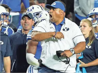  ?? GEORGE FREY, USA TODAY SPORTS ?? Three games in, Brigham Young has 695 yards of total offense under coach Kalani Sitake.