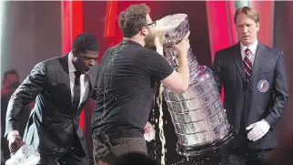  ?? VINCENZO D’ALTO ?? At the tail end of the 2014 Just for Laughs gala, host Seth Rogen was joined on stage by then-Montreal Canadiens defenceman P.K. Subban for a refreshing drink from the Stanley Cup (or a Stanley Cup).