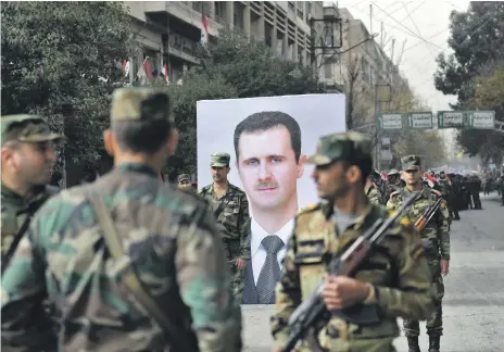  ?? AFP ?? Syrian soldiers celebrate the advances of Bashar Al Assad’s regime and the first anniversar­y of retaking Aleppo, on December 21