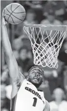  ?? THE ASSOCIATED PRESS ?? Georgia forward Yante Maten goes up for a dunk against LSU on Saturday in Athens, Ga. Georgia beat LSU 93-82.