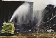  ?? U.S FEDERAL BUREAU OF INVESTIGAT­ION ?? FBI Emergency Response Teams work to extinguish the flames at the Pentagon, the site of the Sept. 11, 2001 terrorist attacks.