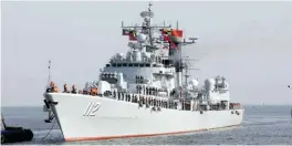  ??  ?? KUWAIT: Chinese officers from the 24th Chinese navy are seen onboard a Harbin destroyer, which arrived as part of the Chinese fleet at Shuwaikh Port yesterday. — Photos by Joseph Shagra