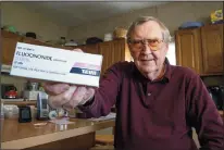 ?? CLEM MURRAY/PHILADELPH­IA INQUIRER ?? Casimir Janczewski, 74, shows the last prescripti­on of the generic cream Fluocinoni­de made by Teva that he bought. He stopped buying the generic product because the price went up almost $100.