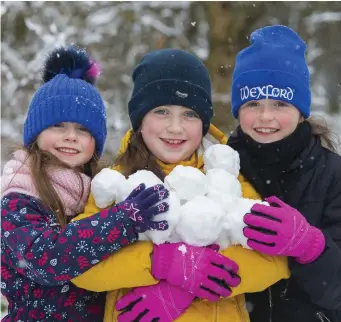  ?? Photo: Patrick Browne ?? Sisters Leah, Aimee and Keelin Gallagher, from Wellington Bridge, Co Wexford, made the most of the recent snowy conditions.