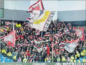  ??  ?? Bayer Leverkusen fans at Ibrox Stadium on March 12 after travelling from Germany to Glasgow for Europa League last-16 first-leg match