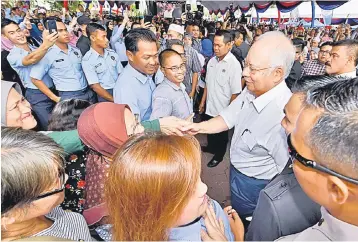  ??  ?? Najib is welcomed by the public during the launch of the Labuan Developmen­t Blueprint yesterday. — Bernama photo