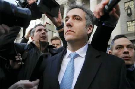  ?? JULIE JACOBSON — THE ASSOCIATED PRESS ?? Michael Cohen walks out of federal court, Thursday in New York. Cohen, President Donald Trump’s former lawyer, pleaded guilty to lying to Congress about work he did on an aborted project to build a Trump Tower in Russia. He told the judge he lied about the timing of the negotiatio­ns and other details to be consistent with Trump’s “political message.”