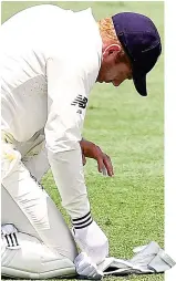  ??  ?? Scare: Bairstow examines finger