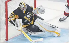  ?? ASSOCIATED PRESS FILE PHOTO ?? A shot by New Jersey Devils’ Will Butcher gets past Pittsburgh Penguins goaltender Matt Murray on Nov. 5.