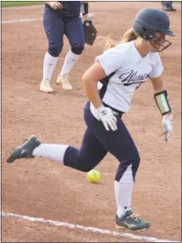  ??  ?? La Plata’s Ashlee Roberts tries to beat out a bunt to first base in Friday’s Class 2A state championsh­ip game versus Catoctin at the University of Maryland’s Robert E. Taylor Stadium in College Park.