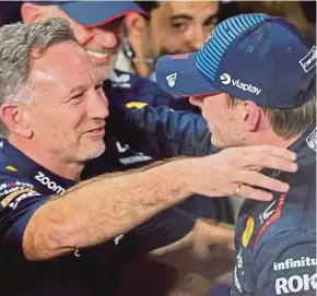  ?? AFP PIC ?? Red Bull’s Max Verstappen (right) celebratin­g with team principal Christian Horner after winning the Saudi Arabian Grand Prix in Jeddah on Saturday.