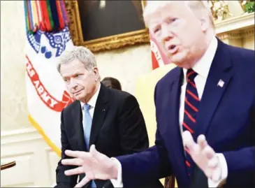  ??  ?? US President Donald Trump meets with Finnish President Sauli Niinisto in the Oval Office of the White House on Wednesday.