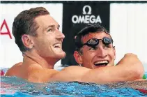  ?? Picture: GETTY IMAGES ?? BROMANCE: Cameron van der Burgh celebrates winning the men’s 50m breaststro­ke final with Giulio Zorzi at the 15th Fina world championsh­ips at Palau Sant Jordi in Barcelona, Spain, on July 31 2013