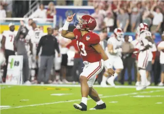  ?? Streeter Lecka / Getty Images ?? Alabama quarterbac­k Tua Tagovailoa celebrates a touchdown in the first quarter, when the Crimson Tide took a 21-0 lead en route to a 45-34 victory over Oklahoma in a playoff semifinal.