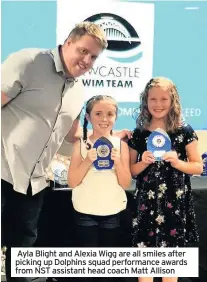  ??  ?? Ayla Blight and Alexia Wigg are all smiles after picking up Dolphins squad performanc­e awards from NST assistant head coach Matt Allison