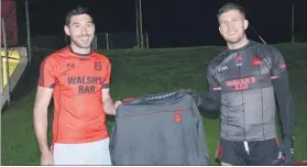  ?? (Pic: John Ahern) ?? Pa Magee and Fionn Herlihy displaying their Páirc TV tops - this local business is another valued sponsor of Mitchelsto­wn GAA.