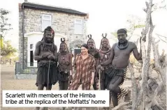  ??  ?? Scarlett with members of the Himba tribe at the replica of the Moffatts’ home
sometimes when the translator­s weren’t there, we would have such a laugh; we’d make songs up, we’d just be singing.