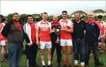  ??  ?? Kilgarvan Hurling team celebrate Adrian O’Sullivan, Flor O’Brien, Pat O’Shea, Pat Twomey, John Mark, Michael and John Foley after their win over Causeway at Lewis Roads, Killarney on SaturdayPh­oto by Michelle Cooper Galvin