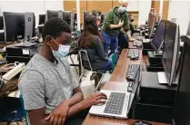  ?? Jerry Lara / Staff photograph­er ?? Freshman Marwan Ismail, 14, works on a lesson during a cybersecur­ity class this month at the Northside School of Innovation, Technology and Entreprene­urship.