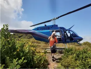  ?? Photo by Jeff Neems. ?? Below left: Glyn Morgan disembarks the helicopter which transporte­d six DOC staff, undertakin­g a range of work, to the top of Mt Pirongia.