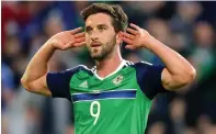  ??  ?? ON FIRE: Will Grigg scored in the victory over Belarus