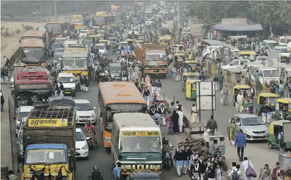  ?? MONEY SHARMA/AFP/GETTY IMAGES ?? Heavy traffic is seen during a smoggy day in New Delhi. When it comes to driverless cars, “Indian roads present a true deep learning challenge,” says Roshy John, a robotics expert at Asia’s largest IT services provider, Tata Consultanc­y Services Ltd.